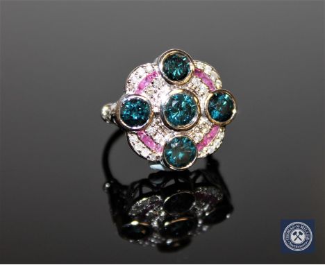 An 18ct white gold Art Deco style diamond and ruby ring, five brilliant-cut, colour-enhanced blue diamonds totalling 2.20 car