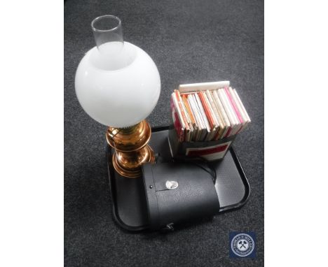 A tray of Duplex copper oil lamp with glass chimney and shade, set of cased binoculars, tin of ordnance survey maps 
