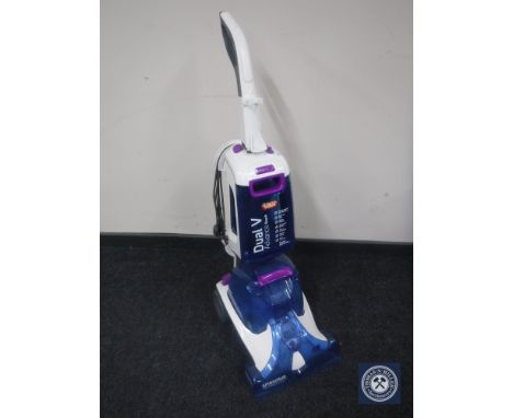 A Vax Dual V Advance Reach carpet washer and bag of accessories and cleaning fluid 