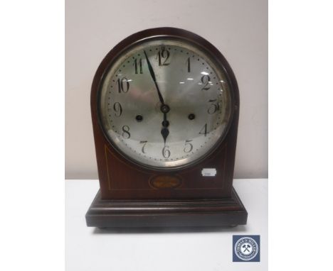 A Victorian inlaid mahogany bracket clock with silvered dial, pendulum and key 