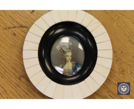 A portrait miniature depicting a lady wearing a bonnet with blue shawl, diameter 11.5 cm.