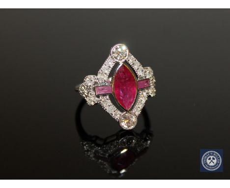 An 18ct white gold ruby and diamond ring, a central marquise-cut deep red ruby weighing 1.34 carat, flanked by two medium-red