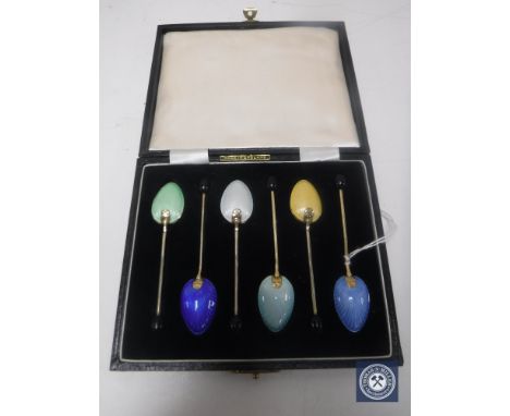 A set of silver and enamelled teaspoons, Birmingham marks, cased. CONDITION REPORT: Enamel appears to be in good condition th