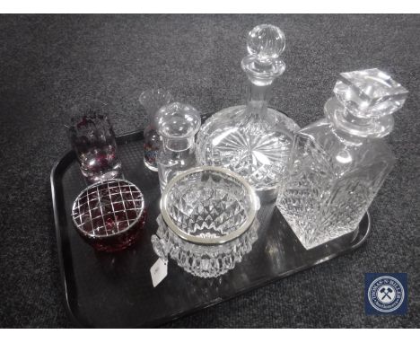 A tray of seven pieces of glass ware - whiskey and ship style decanters, ice bucket, ruby rose bowl etc 