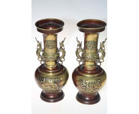 Pair Oriental two handled part bronze patinated vases with relief decoration, 35cm.