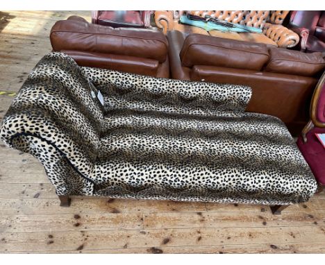 Oak framed chaise longue in leopard print fabric.