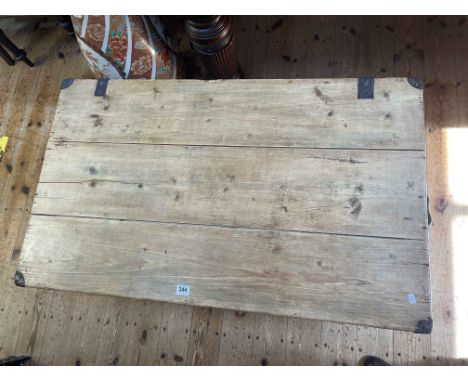 Large stripped pine and metal bound trunk.