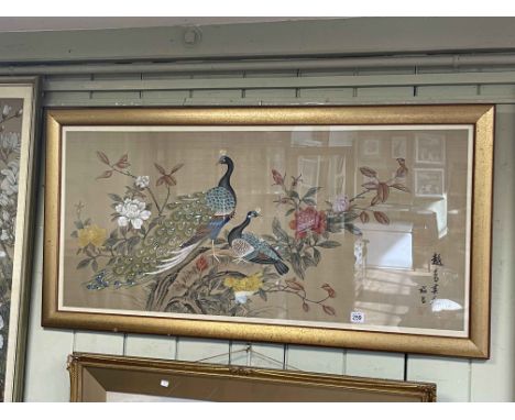 Three framed Chinese silks depicting peacock and birds in foliage, character and seal marks, each approximately 110cm by 60cm