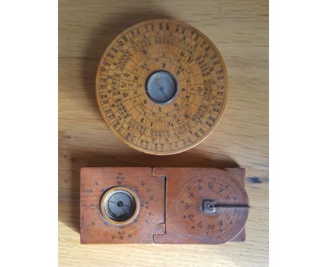 An Asian wooden compass with integral sundial and one other, 3.5" diameter. (2)