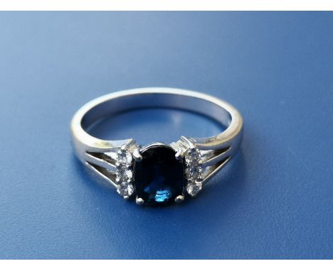 A modern sapphire &amp; diamond set  14ct white gold ring.  Finger size L.