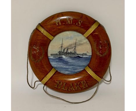 A circular watercolour ship's portrait of HMS Blake, 9" diameter, in painted wooden lifebuoy shaped frame.