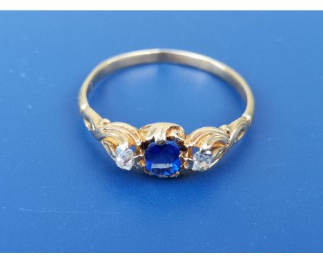 A small 19thC sapphire &amp; diamond set three stone gold ring - tests as 18ct gold.  Finger size M/N.