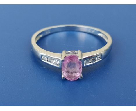 A modern pink sapphire &amp; diamond ring in 9ct white gold. Finger size N.