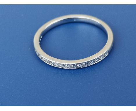 A diamond set platinum half eternity ring.  Finger size N.