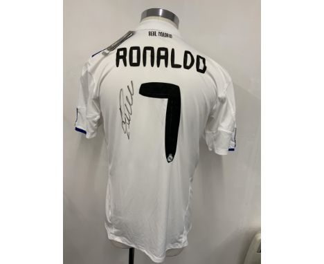 Signed Real Madrid Football Shirts: White unworn replica home shirts two with tags still attached. One has Ronaldo 7 to rear 