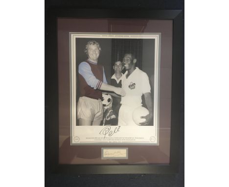 Pele Santos + Bobby Moore West Ham Signed Framed Picture: Large limited edition print of Moore in West Ham kit and Pele in Sa