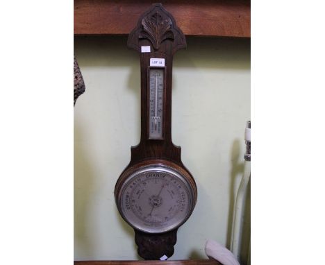An oak backed barometer / thermometer