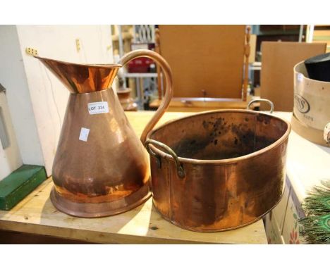 A copper finished planter together with an ale jug