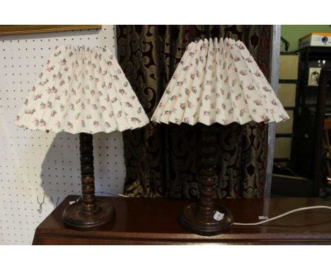 A pair of bobbin turned oak table lamps