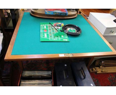 A modern fold over card table of plain form