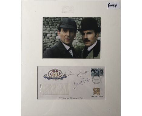 JEREMY BRETT / DAVID BURKE SIGNED. A mounted display to include a reproduced image from the Sherlock Holmes TV series above a