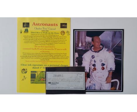 SPACE, signed cheque by astronaut Charles Conrad, dated 3rd Jan 1993, together with a 7.25 x 9 colour photo laid down to blac