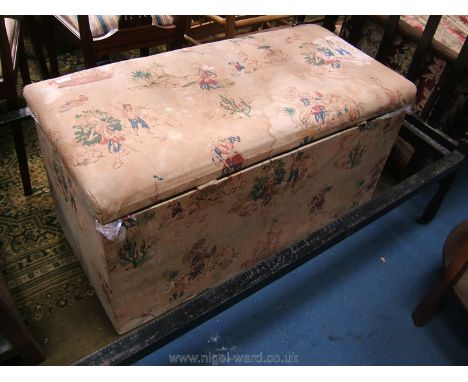 A late 19th c. Box Ottoman, pine carcass and covered in pirate print fabric with ships and pirates