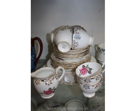 A pretty gilded pink rose Roslyn bone china part Teaset including cake plate, six cups, six saucers, six tea plates, milk jug