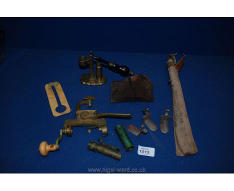 Two re-loading tools, (one for pinfire), cased pull-through, a ''Marbles Game Getter Rod'' in a canvas case, button cleaner e