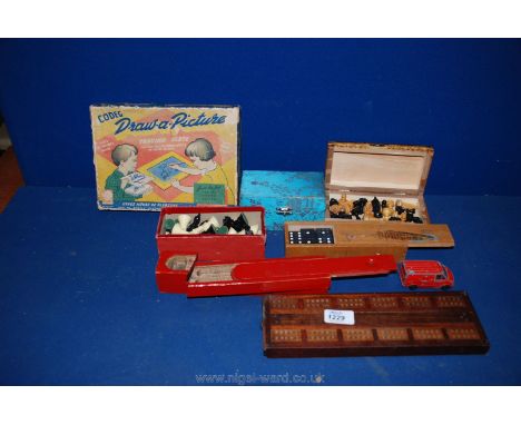 A 'Draw a Picture' Tracing Slate, a Cribbage Board, a wooden two tier pencil case, stress balls, a wooden boxed set of domino