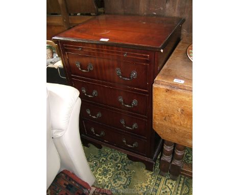 A reproduction Mahogany finished Georgian style Cupboard having single door with false brushing slide and four false drawer f
