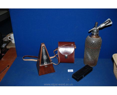 A wooden Metronome, a metal cased soda Syphon with gas cylinder holder,a cased pair of Carl Zeiss Deltrintrem 8 x 30 binocula