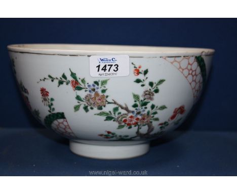 A Famille Verte Bowl with enamel tree and floral decoration, 24cm wide, 12 cm high (small chip to rim)