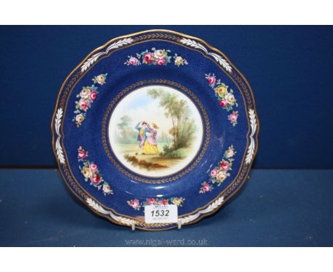 A Copeland Spode plate with scalloped edge in navy with floral decoration and detail of a couple dancing.