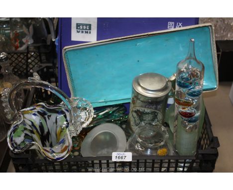 A quantity of glass including a Galileo thermometer, End of Day basket, top hat ashtray, Ikea three tier cake stand, etc.