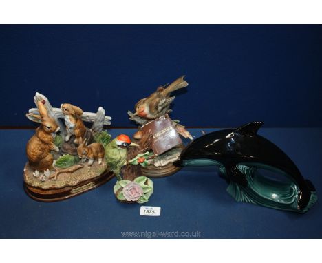 A large Poole Pottery Dolphin and three country wildlife models 