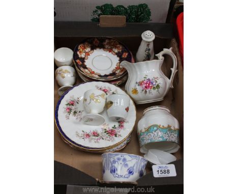A quantity of china including egg cups, saucers, plates, etc. by Wedgwood, Royal Doulton, etc.