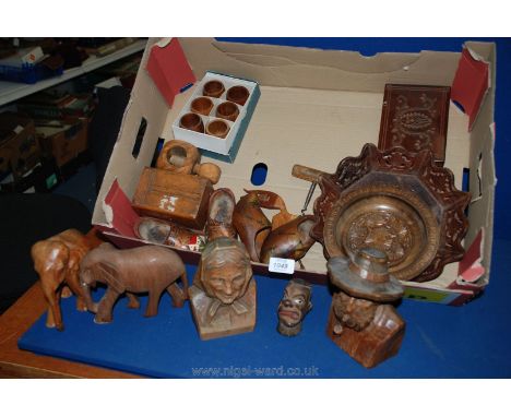 A quantity of Treen including carved heads, napkin rings, nutcracker, corkscrew, clogs, etc.