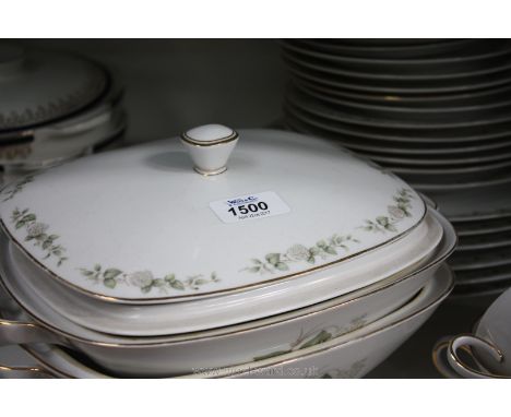 A 'Franconia' pattern Dinner Service decorated with green leaves and berries on white ground including dinner plates, graduat