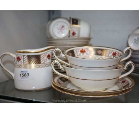 A Royal Crown Derby part Tea/Dinner Service with imari border including milk jug, two soup bowls on stands, four cups, four s