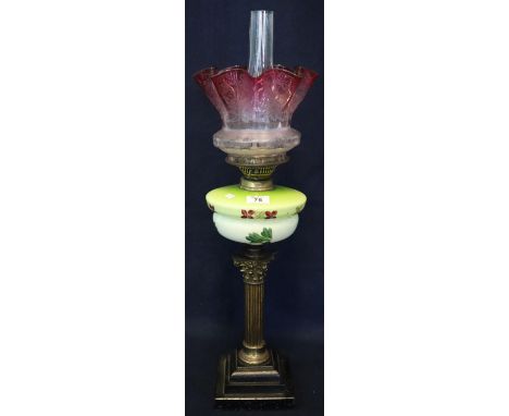 Brass double burner oil lamp with ceramic reservoir on gilded Corinthian column pedestal on stepped base, graduated etched cr
