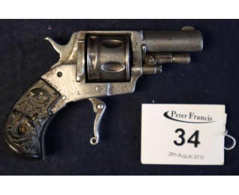 Miniature vintage .22 pin fire pocket pistol with folding trigger and figure decorated (probably bakelite) grip. 10cm long ap