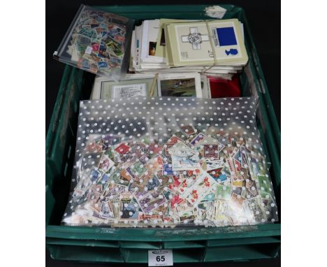 Large green tray of all world stamps in albums, two large packets of off paper and various first day covers.(B.P. 24% incl. V