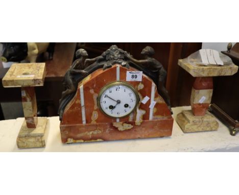 Art Deco design rouge marble two train clock garniture, the clock with spelter climbing children figure mounts and white enam