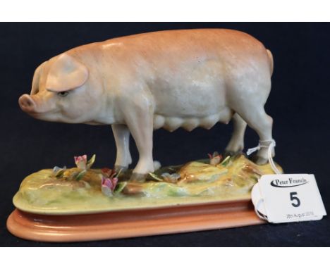 Continental porcelain study of a standing pig on naturalistic base. Underglazed blue printed marks with 'R'. 16.5cm long appr