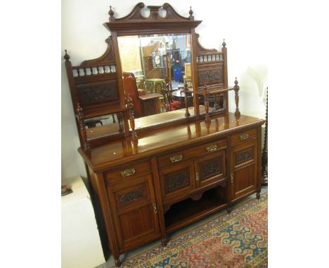 Edwardian mahogany mirror backed sideboard with side shelves, floral moulded panels and an arrangements of drawers, cupboards