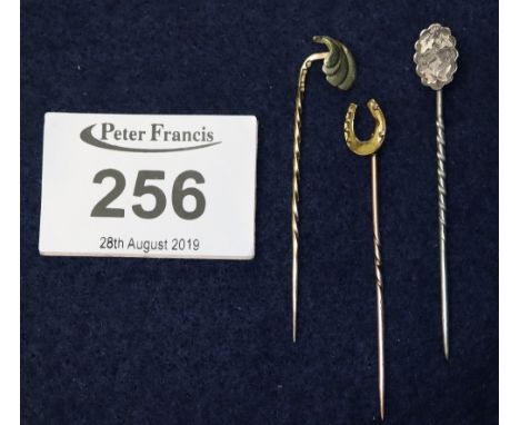 Three stick pin brooches, one 15ct, one 14ct with 9ct pin and a white metal. Weight in total 3.6g approx. (B.P. 24% incl. VAT