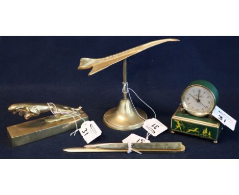 Brass table model of Concorde on brass pedestal, brass Jaguar type car mascot on rectangular plinth, a brass biro and a brass