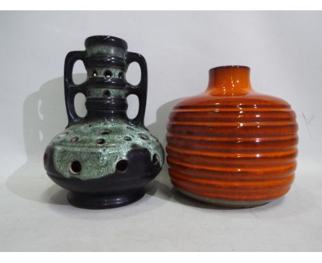Two vintage West German pottery lamp bases, largest approximately 31 cm (h). [W]