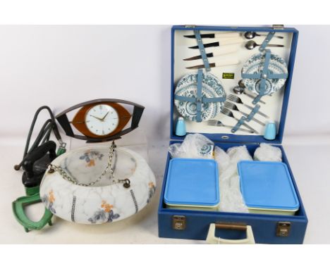 A boxed a Brexton 26 piece service, an Art Deco style mantel clock, a The Rhytm 375U Ratiation gas iron and a glass lamp shad